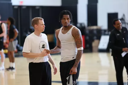 Men's Basketball assistant coach Bryan Tibaldi coaching a player during a practice at Providence College on July 22, 2025