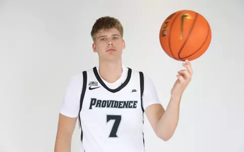 Stefan Vaaks is pictured spinning the basketball in his left hand while he looks at the camera during their photoshoot.