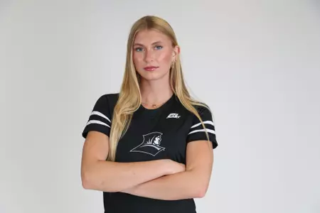 Tori Otter is pictured with both arms crossed in front of her during team photoshoot for pre-season 2025 photos.