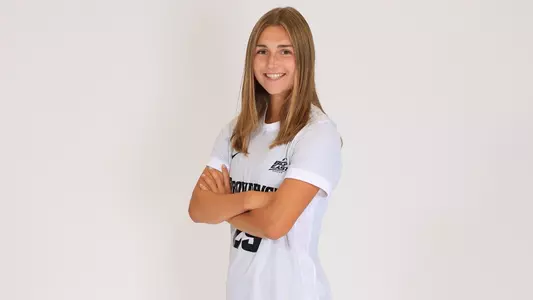 Women's soccer player Ahnna Faust poses for a photo with her arms crossed during a preseason photoshoot in 2025