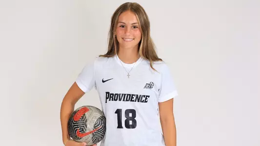 Women's soccer player Eden Wheeler poses for a photo with a ball in her hand during a preseason photoshoot in 2025