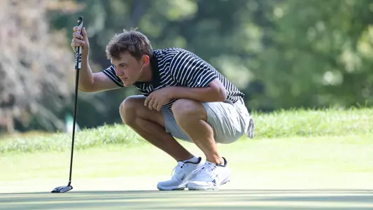 Men's golf player Joe Halferty reading a putt