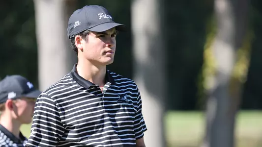 Men's golf player Callan Fahey looking down the fairway during a round