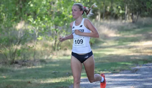 Gabrielle Schmidt running at the Friar invitational Cross Country meet on September 5th, 2025