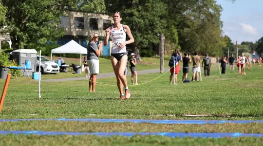 Kate Currie running at the Friar invitational Cross Country meet on September 5th, 2025
