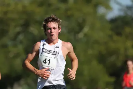 Jack Dowd running during a 2025 cross country meeet.