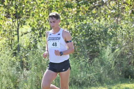 Grady Satterfield running during a 2025 cross country meet. 