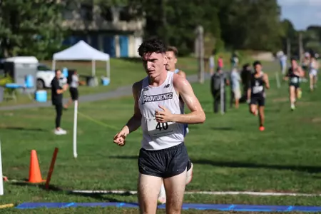 Cormac Dixon running during a 2025 cross country meet.