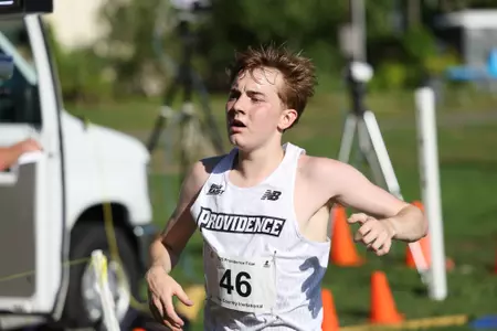 Daniel Prescott crossing the finish line during a 2025 cross country meet.