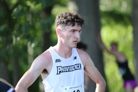 Cormac Dixon stands with his hands on his hips after finishing a 2025 cross country race.
