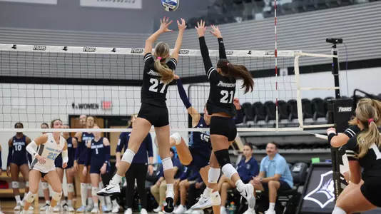 Kaia Easterbrook and Sophia Adkins Blocking at Alumni Hall in Providence, R.I. on Friday, Sept. 5 in their 3-0 win over Rhode Island