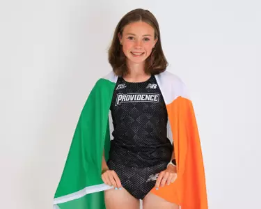 Niamh O'Mahony holding the Irish flag around her shoulders
