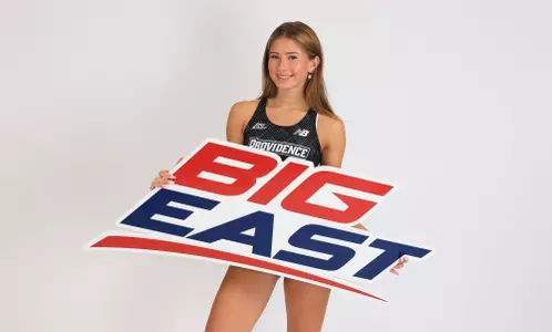 Chloe Higgins holding a Big East sign