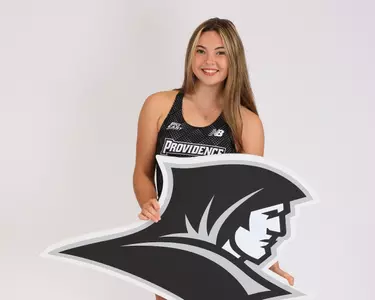 Natalie Wamback holding a friar sign