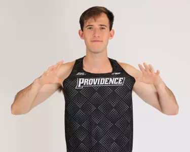 Kyle Bloomer holding his uniform
