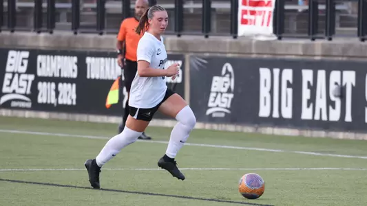 Women's Soccer player Colleen Casey runs with the ball at Chapey Field at Anderson Stadium versus Army