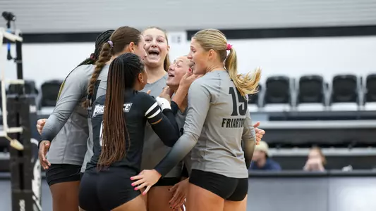2025 Volleyball Team Celebrating in their match against Brown at Alumni Hall