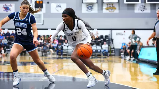 Sabou Gueye dribbling past a Villanova defender during a Big East game at Alumni Hall in Providence, R.I.