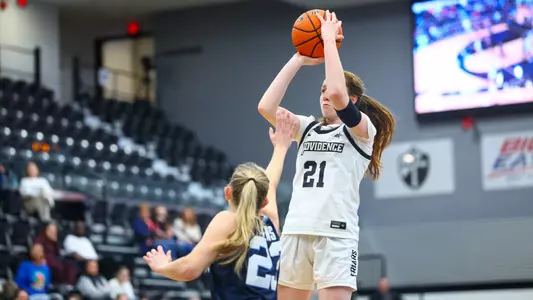 Payton Dunbar shooting a jump shot with a Villanova defender on her at Alumni Hall in Providence, R.I.