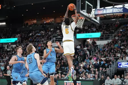 Jamier Jones Dunks the Ball versus Villanova at the Amica Mutual Pavilion. 