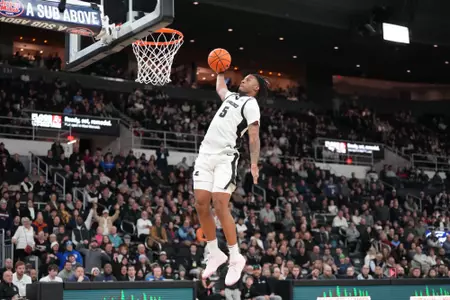 Jamier Jones dunks the ball on the fast break versus Creighton at the Amica Mutual Pavilion. 