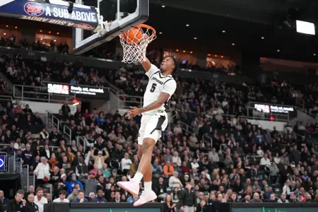 Jamier Jones dunks the ball on the fast break versus Creighton at the Amica Mutual Pavilion. 