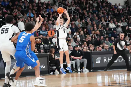 Stefan Vaaks shoots a three from the wing versus Creighton at the Amica Mutual Pavilion. 