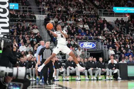 Jamier Jones saves the ball on the baseline versus Creighton at the Amica Mutual Pavilion. 