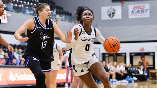 Sabou Gueye driving to the basket at Alumni Hall during a Big East game against Creighton