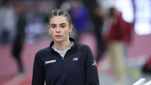 Women's track runner Ava Russell warming up