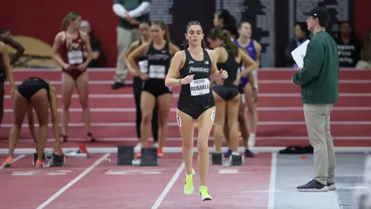 Women's track runner Ava Russell warm up strides