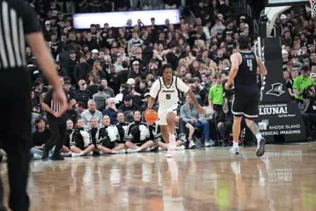 Jamier Jones dribbles the ball up the floor versus Georgetown at the Amica Mutual Pavilion. 
