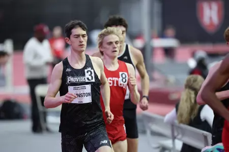 Will Johnston running on the track at the Harvard Beantown Challenge