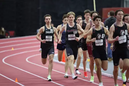 Tyler Bartlett running on the track at the Harvard Beantown Challenge