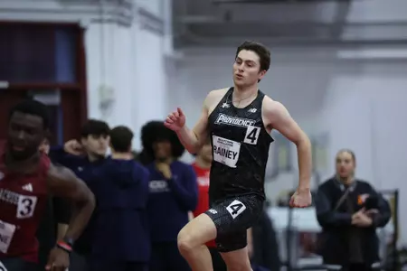 Will Rainey running on the track at the Harvard Beantown Challenge
