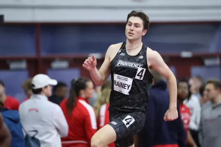 Will Rainey running on the track at the Harvard Beantown Challenge