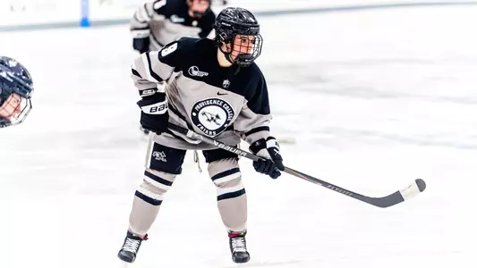Women's ice hockey player Kiara Kraft waiting for the puck to be dropped