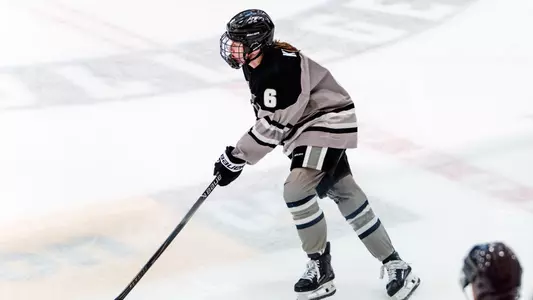 Women's ice hockey Audrey Knapp skating with the puck during a game