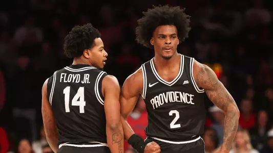 Jaylin Sellers talks to Corey Floyd Jr. on the court at Madison Square Garden at St. John's. 