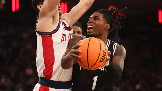 Jason Edwards shoots layup over defender at Madison Square Garden at St. John's. 