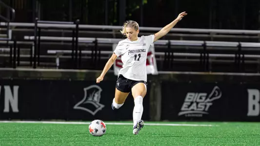 Carolyn Hinkle kicking soccer ball