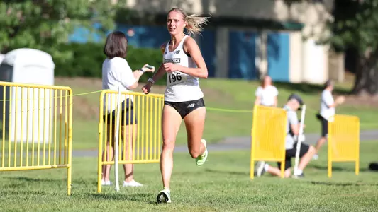 Women's cross country runner Anna Gardiner running at the Friar Invitational