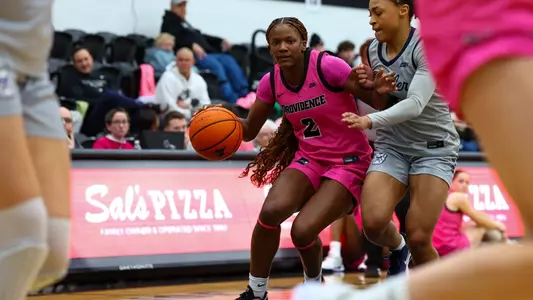 Princess Moody dribbling past a Butler defender during a BIG EAST game at Alumni Hall in Providence, R.I.