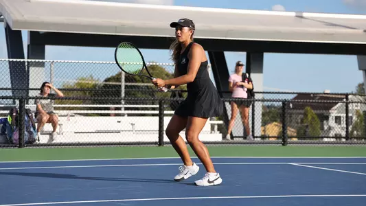 Women's Tennis' Gabriella Plonowski in action in a match against Assumption University