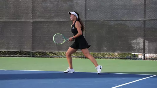 Women's Tennis' Lauren Krise in action against Assumption