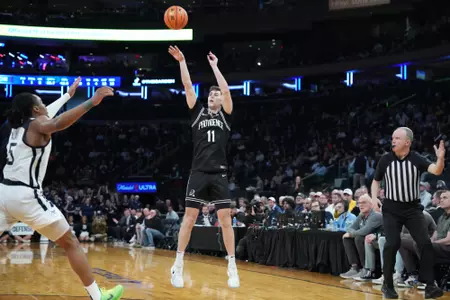 Ryan Mela shoots a three Providence College vs Butler at Madison Square Garden at the BIG EAST Tournament