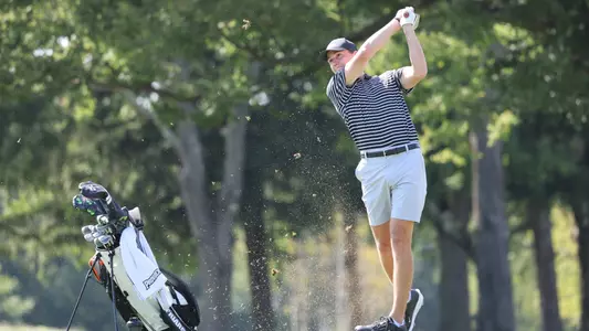 Men's golfer Logan Jaeger hitting an iron shot