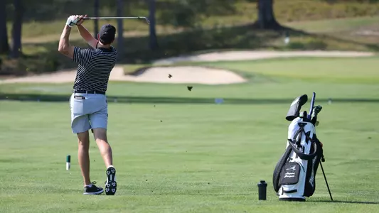 Men's golfer Logan Jaeger hitting a shot