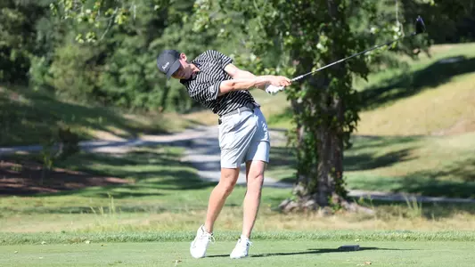 Men's golfer Liam O'Grady hitting a tee shot