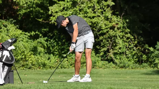 Men's golf player Callan Fahey hitting a tee shot